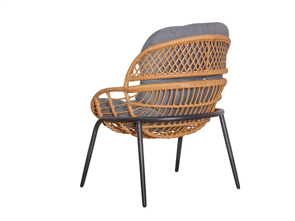Wicker chair with gray cushion on a white background