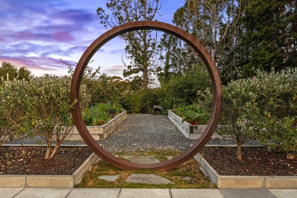 Corten steel ring garden art feature with natural rust patina — Leading Landscapes Canterbury