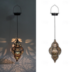 A hanging Moroccan-style metal lantern pendant lamp shown in two views: one lit and casting decorative shadows on a dark wall, and one unlit against a white background. The lamp has an ornate cutout metal body with warm amber and gold tones.