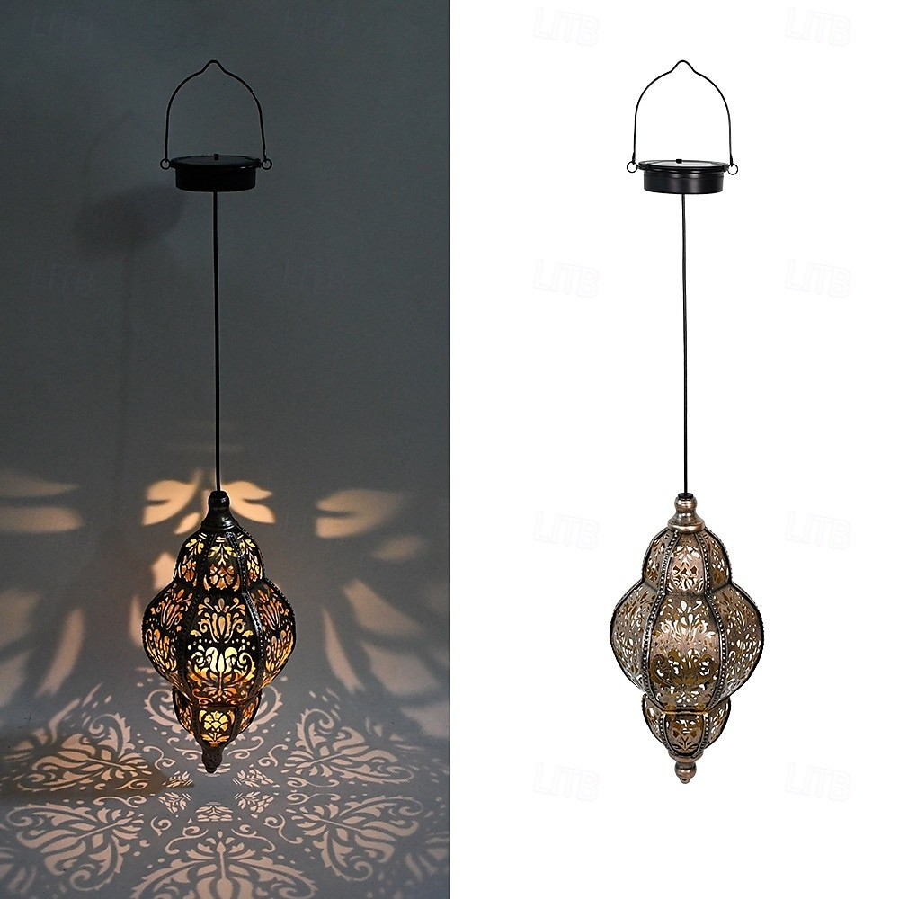 A hanging Moroccan-style metal lantern pendant lamp shown in two views: one lit and casting decorative shadows on a dark wall, and one unlit against a white background. The lamp has an ornate cutout metal body with warm amber and gold tones.