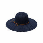 A navy blue woven sun hat with a wide brim, a thin brown band, and a small bow detail on the side, shown against a plain white background.