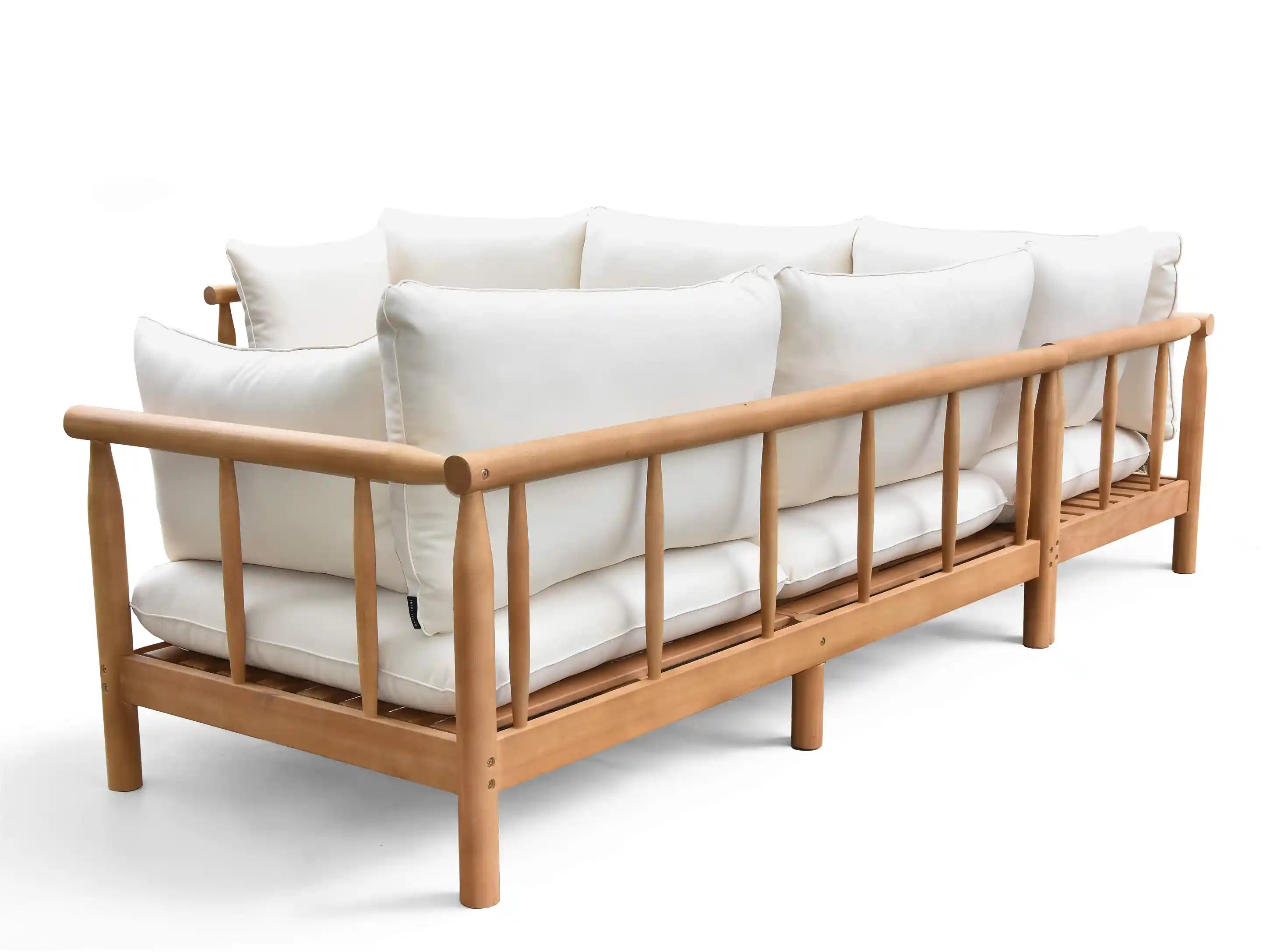 Wooden sofa with white cushions on a white background
