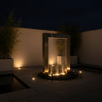 Stainless steel rain curtain water feature in a modern paved setting - Leading Landscapes Limited